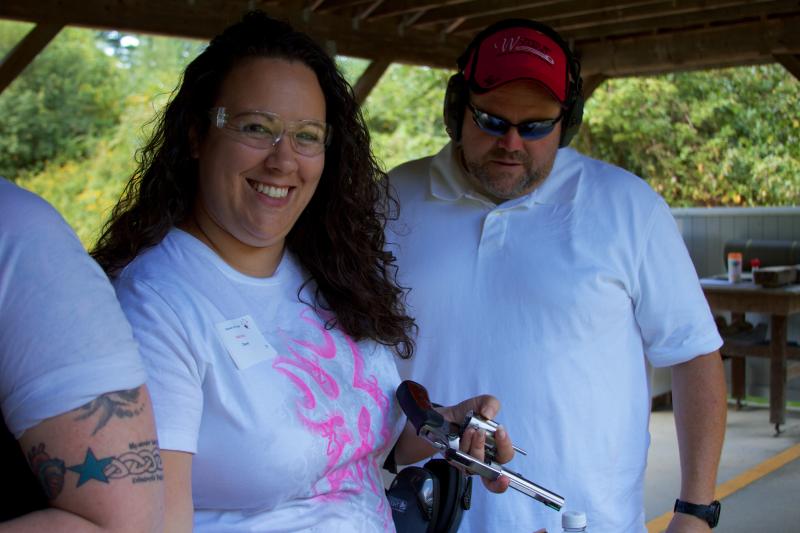Nicole Daniel, whose husband is the president of the Sippican Rod & Gun Club, loads a six shooter. BY GEORGIA SPARLING